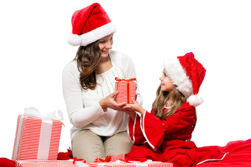 Happy smiling mother and daughter in Christmas caps isolated on white background give a gift. Happy family celebration. Merry Christmas. Sale. Black Friday. Shopping