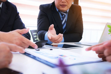 Group business people brainstorming and analyze of sales plan in the future.