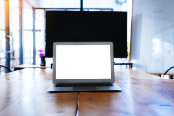 workplace of business with laptop blank white screen at meeting room. close up hands on a keyboard.Top view,Workplace strategy Concept.