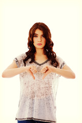 Obraz premium Unhappy young woman with thumbs down