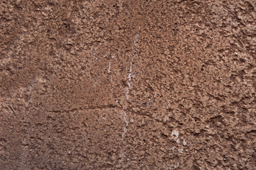 The texture of rough brown stone rock. Natural design element for any purpose. Surface of the rock with brown tint