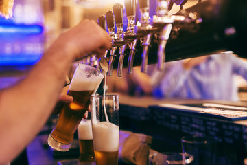 Bartender pouring beer.