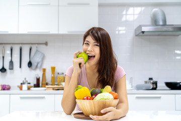 Young beautiful woman take care her health by eating salad and fruit instead of eating fat and calories
