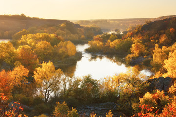 Autumn sunrise on the banks of the river, beautiful fall season landscape