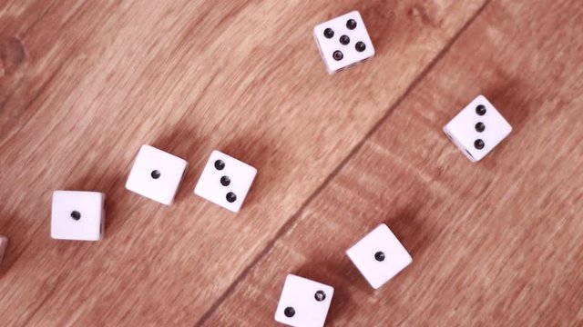 Throwing white dice on floor