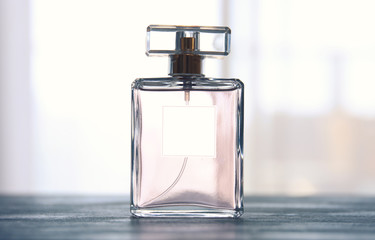 Image of elegant perfume bottle. back light photo