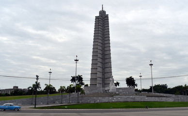 jose marti monument and a classic car