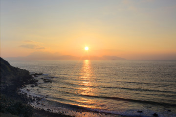 the cape the sunset and the waves in the bay in hong kong, Green Island, south china sea