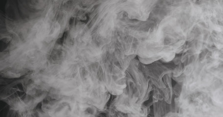 Fototapeta premium Slow motion closeup vapor floating in air on black background