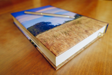 Fototapeta premium business communication and work planning. notebook with pen on the table