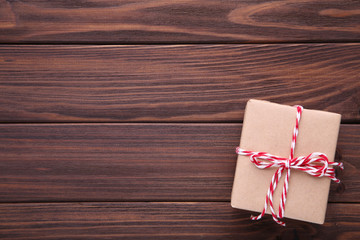 Gift presents box on a brown background.