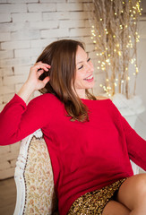 Fototapeta premium Beautiful woman in elegant dress at Christmas time