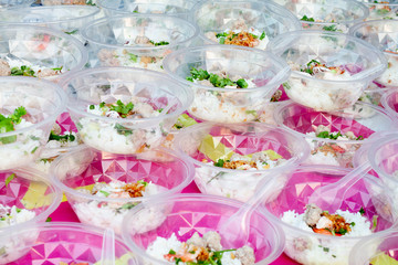 Fototapeta na wymiar Rice boiled pork and shrimp in a plastic bowl. For party