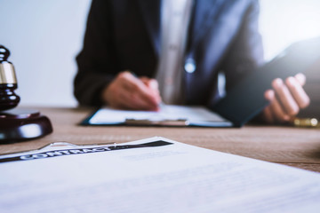 Lawyer business women working and writting in notebook on desk at office. consultant lawyer, justice and law ,attorney, court judge, concept.