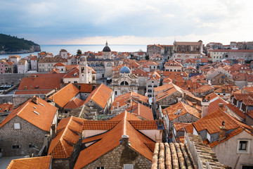 Fototapeta na wymiar View over the roofs of old town Dubrovnik with church towers and ocean in winter, Croatia