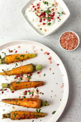 Healthy roasted carrots On white background