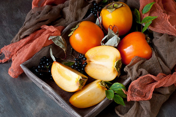 Fresh persimmons in wooden box