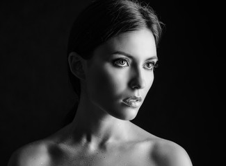 Black and white portrait of a beautiful young woman.