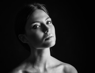 Black and white portrait of a beautiful young woman.