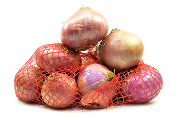 Pack of red onions isolated