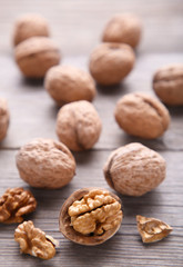 Walnuts kernels on grey wooden background. Walnut healthy food
