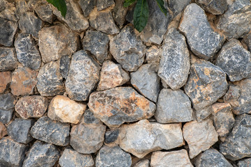 stone wall with varity size of rock texture and background