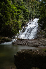 Beautiful waterfall flowing through a tropical rain forest in Thailand (Ton Prai, Lam Ru, Thailand)