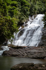 Beautiful waterfall flowing through a tropical rain forest in Thailand (Ton Prai, Lam Ru, Thailand)