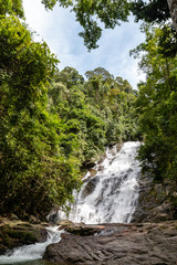 Naklejka na ściany i meble A beautiful waterfall in the tropical rainforest