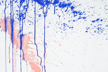White Plastered Wall With Drips Or Flows And Paint Sprays. Pink And Blue Paint Dripping Down On...