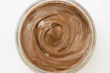 Chocolate hazelnut spread in glass bowl. Hazelnut Nougat cream.