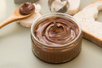 Chocolate hazelnut spread in glass bowl. Hazelnut Nougat cream.