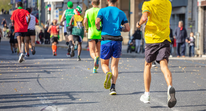 Marathon runners crossing finish line