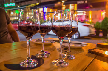 four glasses of wine on the table, evening