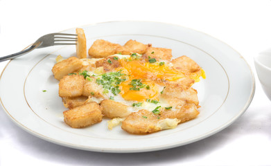 Banh bot chien - Vietnamese cuisine: a Vietnamese street-food of crispy and chewy rice cakes surrounded by an omelet-style amount of eggs, green onions.  It is a Chinese-influence pastry.