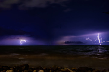 Lightning in the sea during the night storm