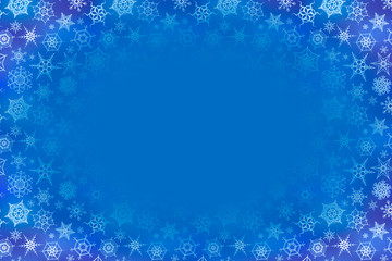 A lot of frozen snowflakes on blue winter background with text place