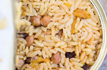 Rice in a tin can. Cooked rice. Rice in an iron pot.