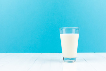 milk glass blue background copy space