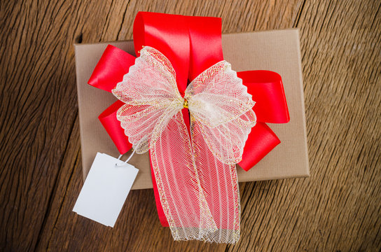 brown gift box with tag