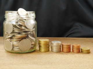 coins and calculator on white background