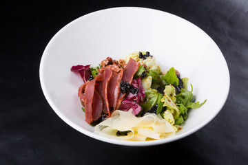 Elegant duck meat salad with caviar