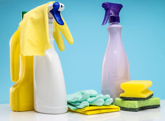Domestic cleaning utensils insulated on a blue background