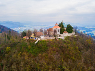 Fototapeta na wymiar Mount Saint Mary (Slovene: Šmarna gora, Smarna gora), originally known as Holm, is an popular hiking site north of Ljubljana, Slovenia