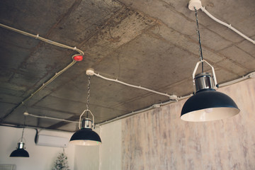 Large lamps with a metal chrome-plated lampshade as part of the interior.