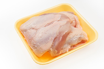Fresh chicken fillets with skin in package