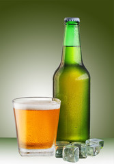 a glass of beer with a bottle