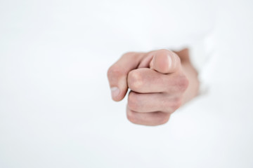 man's hand breaking through the paper wall and pointing at you