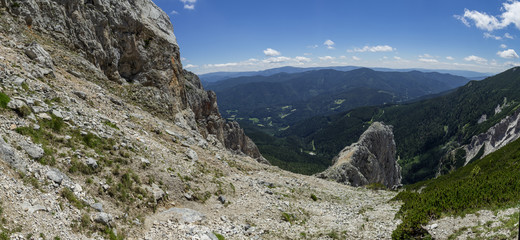 Narrow rock ridge sticking out of the steep slope