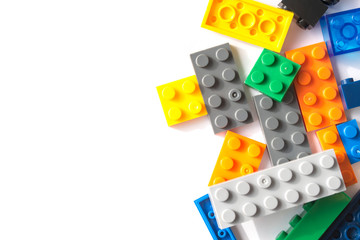 Plastic building blocks isolated on white background. Free space for inscriptions.